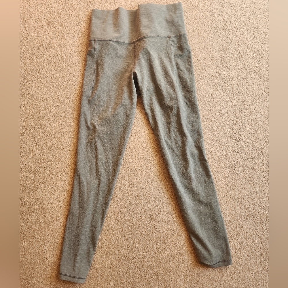 Athleta Salutation stash legging, size small in grayish green heathered color.